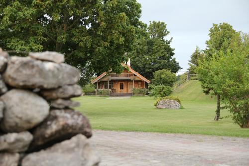 a house on a hill with a pile of rocks at Kangru Holiday Home in Vanamõisa