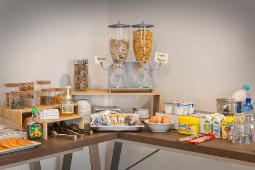 a kitchen with a counter with food on it at Le Betulle in Colà di Lazise
