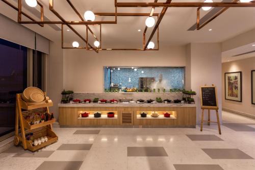 a store with a flower display in a room at Holiday Inn Bengaluru Racecourse by IHG in Bangalore