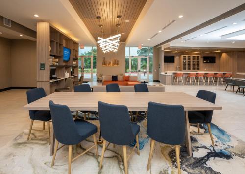 a large conference room with a large wooden table and chairs at Holiday Inn - NW Houston Beltway 8 by IHG in Houston
