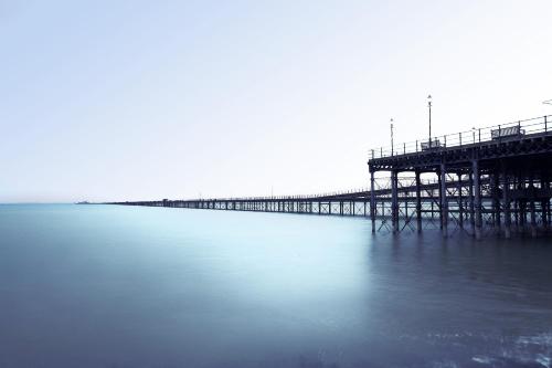 a pier in the middle of the water at Holiday Inn Southend by IHG in Southend-on-Sea