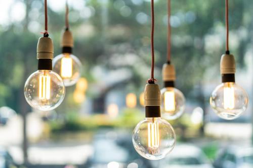 a group of light bulbs hanging from strings at Holiday Inn Bournemouth by IHG in Bournemouth