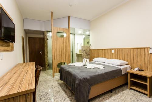 Tempat tidur dalam kamar di Hotel Dan Inn Campos do Jordão