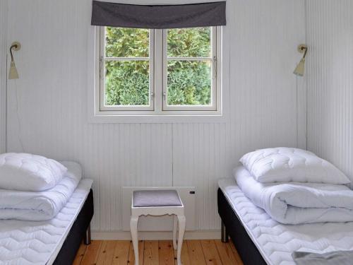 Postel nebo postele na pokoji v ubytování Holiday home Idestrup VIII