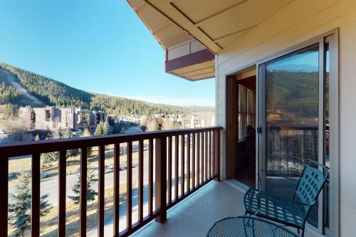 a balcony with a chair and a view at Copper Springs 426 in Frisco