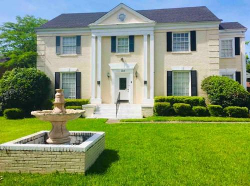 a house with a fountain in front of a yard at ONE OF THE BEST BARGAINS IN TOWN 50.00 A DAY in Montgomery