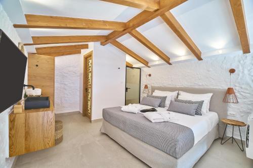 Posteľ alebo postele v izbe v ubytovaní Vista Del Porto Luxury Suites