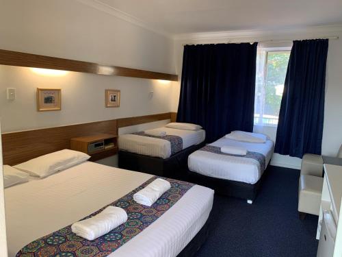Postel nebo postele na pokoji v ubytování Panorama Motor Inn