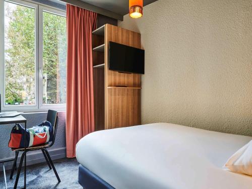 Posteľ alebo postele v izbe v ubytovaní ibis Styles Paris Alesia Montparnasse