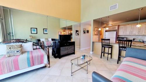 a living room with a couch and a kitchen at Castle B17 Contemporary Condo with Pool, Beach Access and Free Parking in Miami Beach