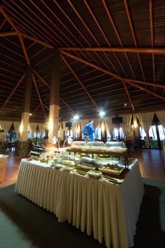 a buffet of food in a large building at Bohol Beach Club in Panglao