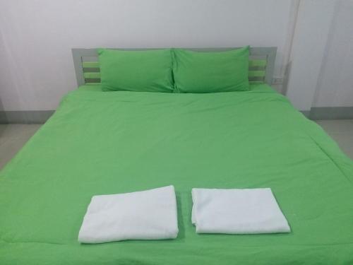 מיטה או מיטות בחדר ב-Chawalee Place