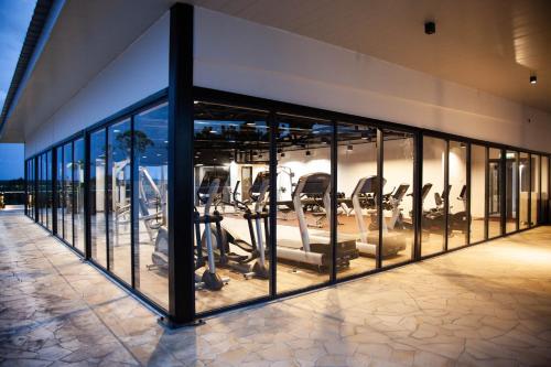 a gym with treadmills and ellipticals in a building at UCSI Hotel Kuching in Kuching