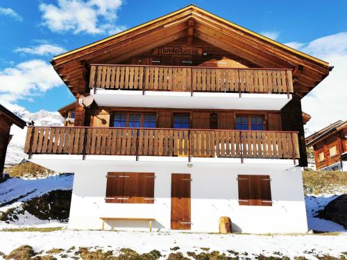 a house in the snow with a balcony at Monte Leone in Belalp