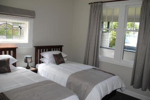 מיטה או מיטות בחדר ב-Linton Cottage