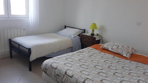 Katil atau katil-katil dalam bilik di SUPER SPACIEUX GÎTE PROCHE DE TOUTES COMMODITÉS