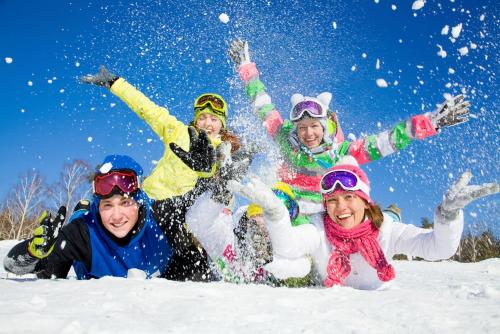 a group of people playing in the snow at Monte Leone in Belalp