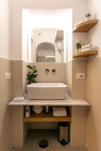 a bathroom with a sink and a mirror at Bellamania B&B in Anacapri