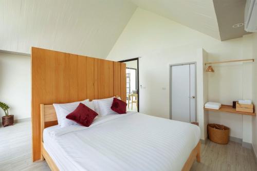 Una cama o camas en una habitación de Baan Ga-Cha