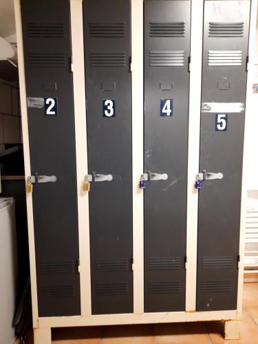 a row of lockers with numbers on them at STUDIOS MAGUI in Ax-les-Thermes