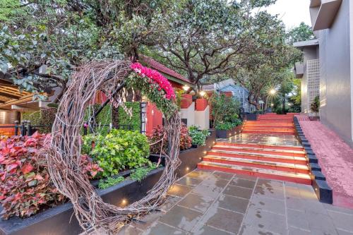 a garden with a bunch of plants and flowers at Club Mahindra Saj Mahabaleshwar in Mahabaleshwar
