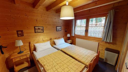 Postel nebo postele na pokoji v ubytování Vieux Valais VA