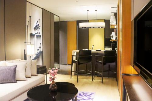 a living room with a couch and a table at Kempinski Residences Guangzhou - Free shuttle between hotel and Exhibition Center during Canton Fair & Exhibitor registration Counter in Guangzhou