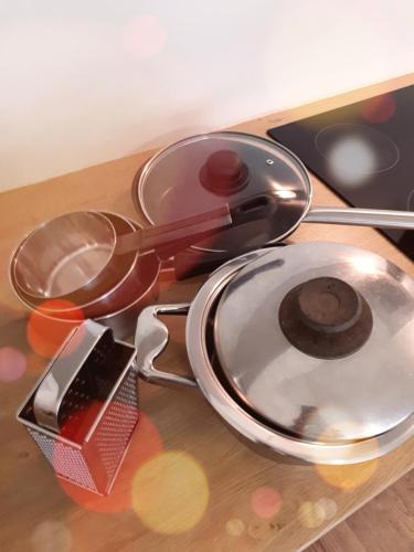 a group of utensils sitting on top of a table at Apartment Bruneck Central in Brunico