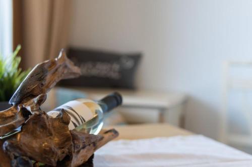a bottle of wine sitting on top of a table at Apartment Noemi in Bad Goisern