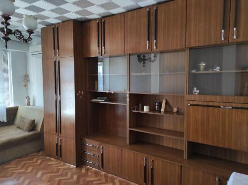 een grote houten kast in een woonkamer bij Apartment next to the center NO TV NO WI FI in Pazardzhik
