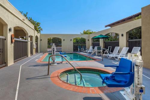 a swimming pool with a slide in a resort at Comfort Inn South San Jose - Morgan Hill in Morgan Hill