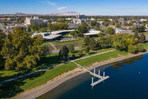 an aerial view of a city with a bridge over the water at Holiday Inn Richland on the River by IHG in Richland