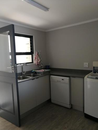 a kitchen with a sink and a counter top at The View in Glengariff
