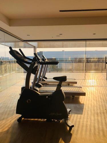 a exercise bike in a room with a view at Novotel Criciuma in Criciúma