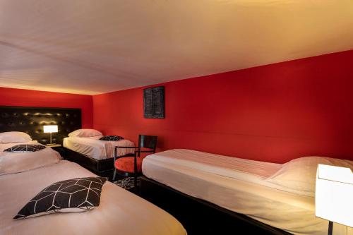 Een bed of bedden in een kamer bij Hotel Rembrandt