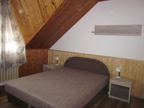 Postel nebo postele na pokoji v ubytování Tóth Vendégház