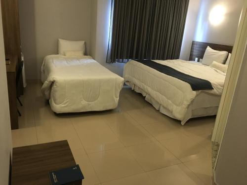Voodi või voodid majutusasutuse Hotel Abba Goiana PE toas