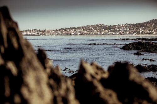 a view of the ocean from a rocky beach at Hotel Arce in Baiona
