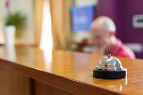a silver bell sitting on top of a table at Hotel Arce in Baiona