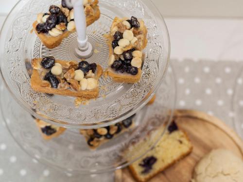 a glass display with desserts on a glass plate at Hotel Arce in Baiona