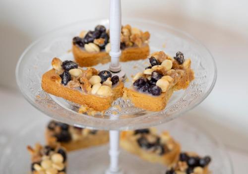 a plate of food with blueberries and other desserts at Hotel Arce in Baiona