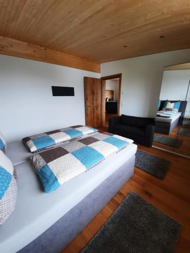 A bed or beds in a room at Alpha Apartment