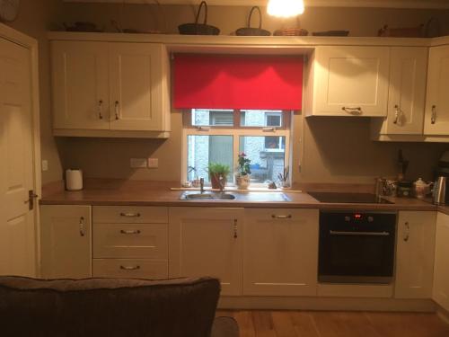A kitchen or kitchenette at Coolanowle Self Catering Holiday Accommodation