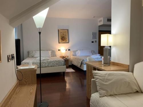 Ένα ή περισσότερα κρεβάτια σε δωμάτιο στο Hotel Logonovo