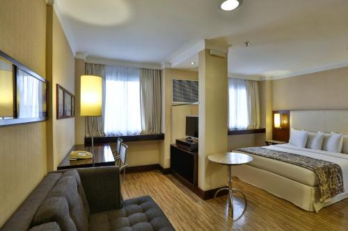 Ένα ή περισσότερα κρεβάτια σε δωμάτιο στο Transamerica Prime International Plaza (Paulista)