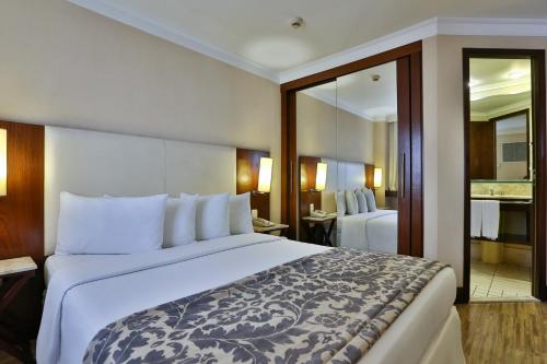 Cama ou camas em um quarto em Transamerica Prime International Plaza (Paulista)