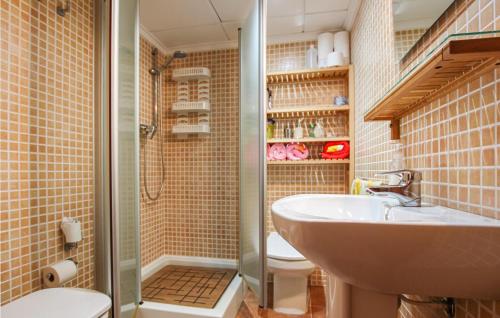 a bathroom with a shower and a sink and a toilet at Cozy Home In Orihuela in Orihuela