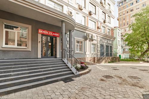 a building with a sign on the front of it at Hotel Classic in Kyiv