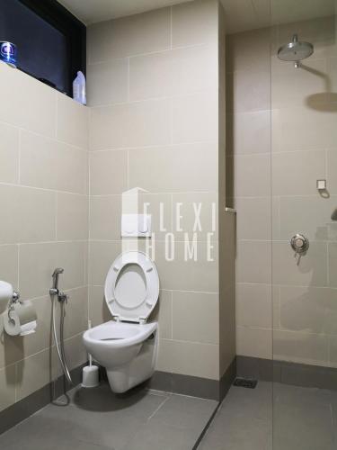 a bathroom with a toilet and a shower at 9am-5pm, SAME DAY CHECK IN AND CHECK OUT, Work from Home, Comfy & Quiet Tamarind Suites-Cyberjaya by Flexihome-MY, in Cyberjaya