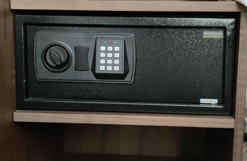 a microwave oven sitting on top of a shelf at Blue Bells Hotel in London